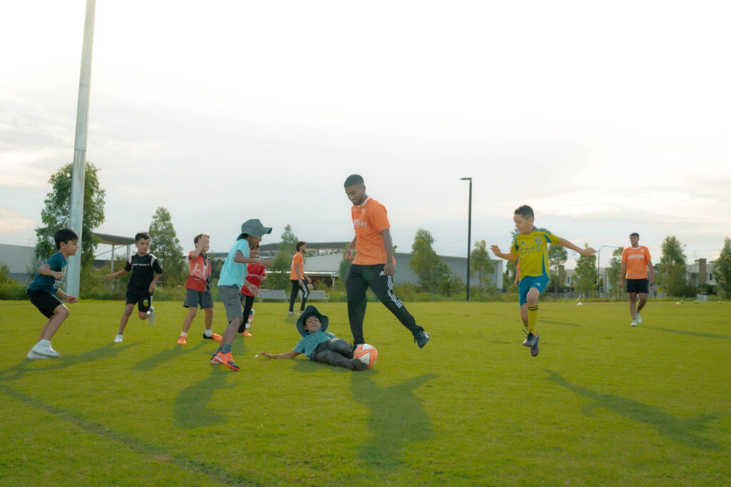 Children enjoying a soccer match at a Sunshine Sports session